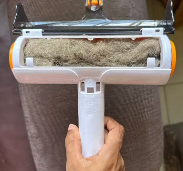 Open roller compartment containing collected pet hair